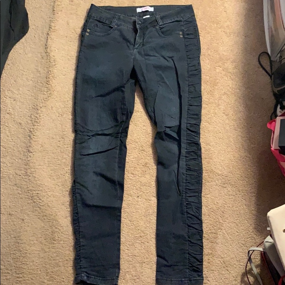 Dark wash ruffled side skinny jeans
